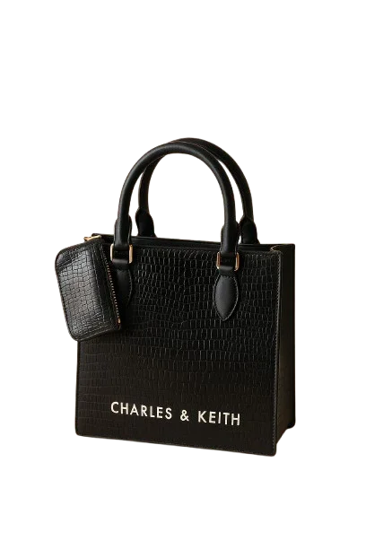 Black Charles & Keith handbag with textured pattern, top handles, and matching pouch, Bagvalleypk