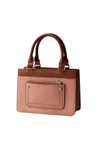 Elegant pink and brown leather handbag with textured front pocket, available at Bagvalleypk.