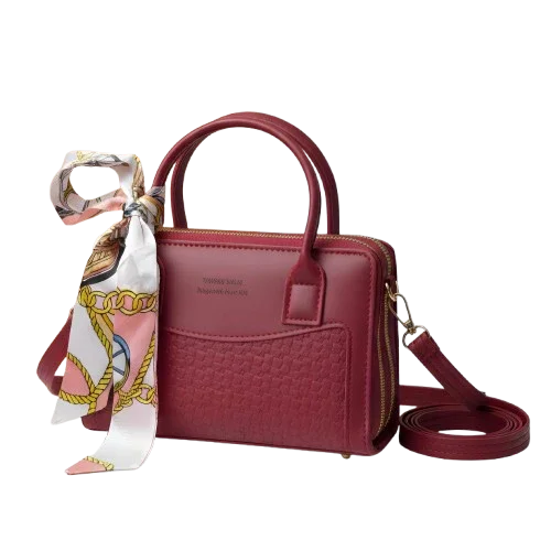 Maroon structured handbag with top handles, gold hardware, and a patterned scarf, Bagvalleypk