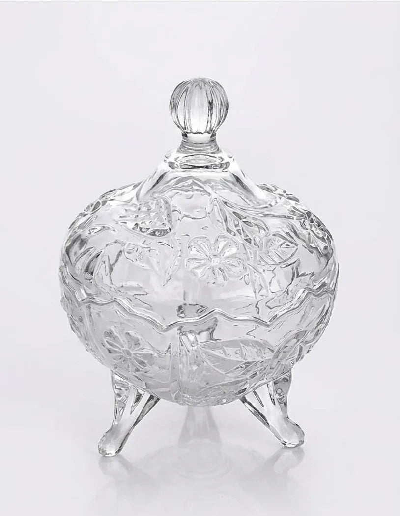 Elegant clear glass jar with floral patterns, decorative lid, and three legs, Bagvalleypk home decor.