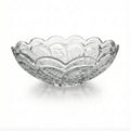 Elegant clear glass bowl with floral and geometric patterns, displayed on a white background
