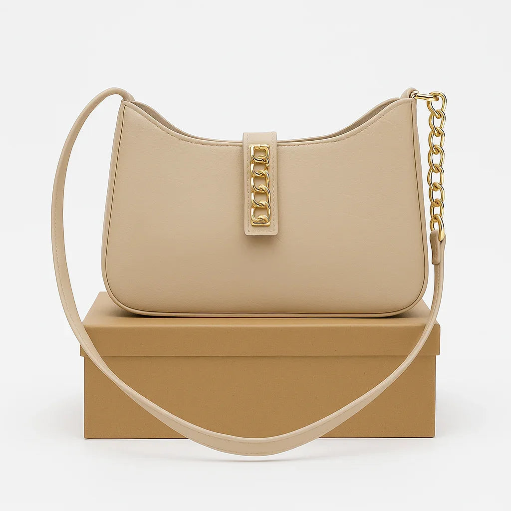 Beige handbag with gold chain detail on brown box, Bagvalleypk premium bag collection